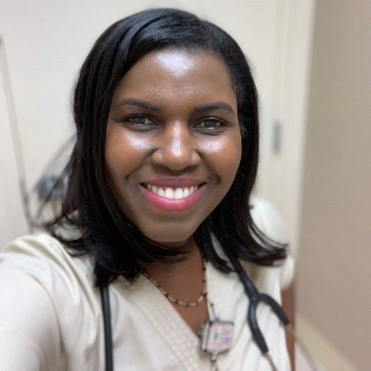 Widlaine Casseus, founder of Bright Care Academy, smiling with a stethoscope around her neck.